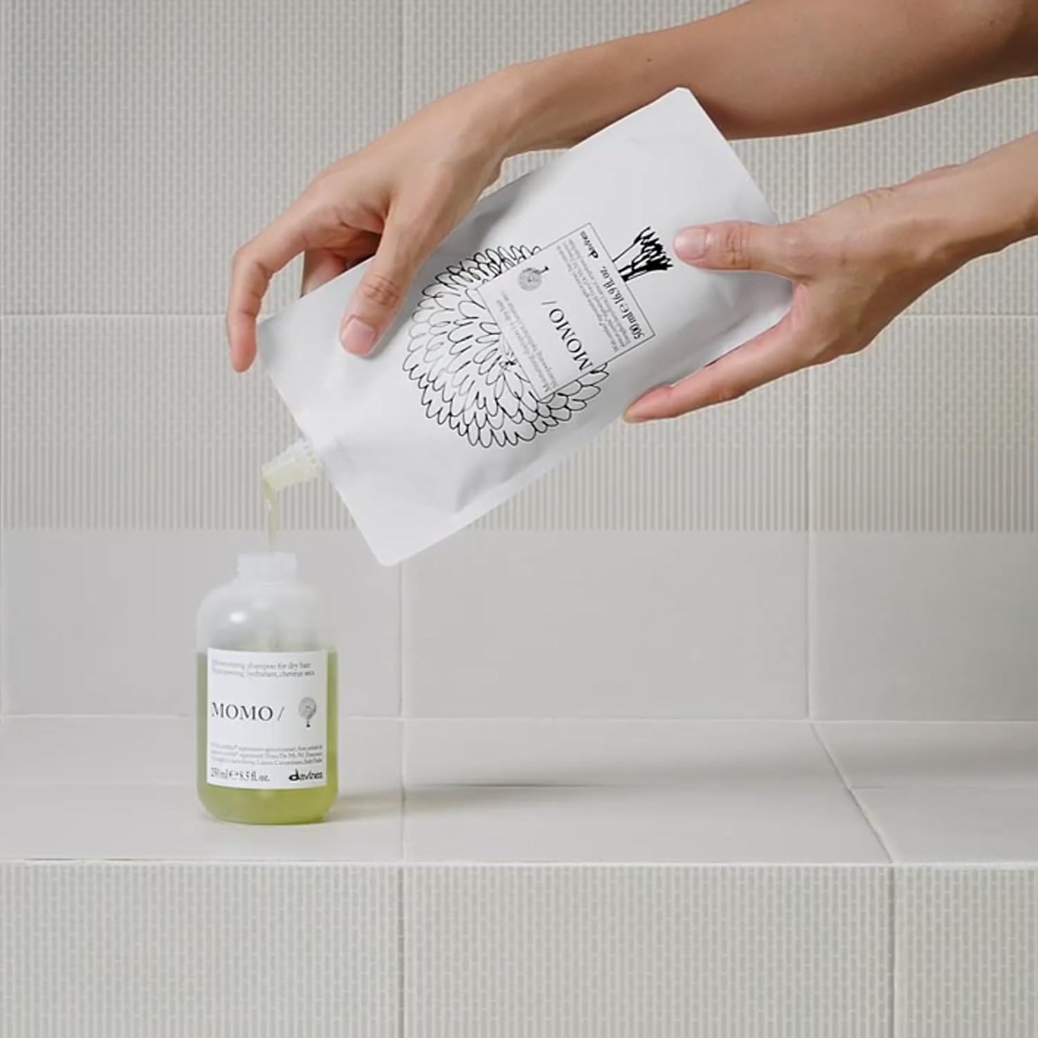 Davines Bundle of MOMO/Shampoo. 8.5 fl oz. + MOMO/Shampoo Refill | Moisturizing shampoo refill pouch for dry and dehydrated hair.
